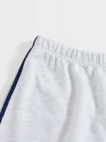 Women's stretch shorts with embroidered letters - Image 4