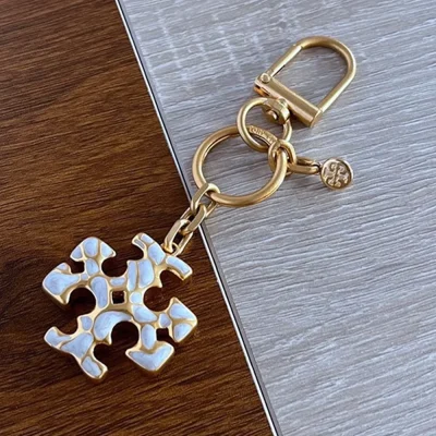 Tory Burch Gold & White Enamel Keychain – Signature Logo Charm