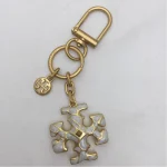 Tory Burch Gold & White Enamel Keychain – Signature Logo Charm - Image 4