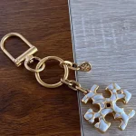 Tory Burch Gold & White Enamel Keychain – Signature Logo Charm - Image 10