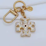 Tory Burch Gold & White Enamel Keychain – Signature Logo Charm - Image 8