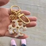 Tory Burch Gold & White Enamel Keychain – Signature Logo Charm - Image 9